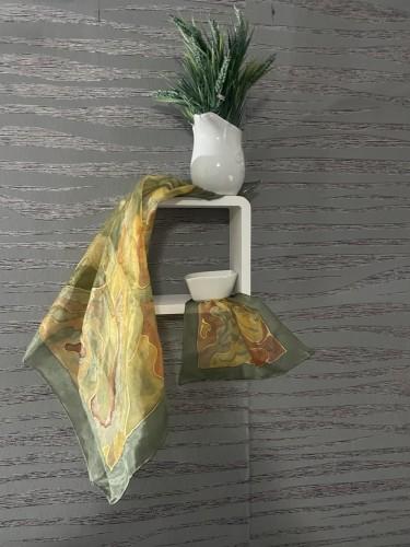 A set of silk scarves in autumn tones by Biljana Pejcic